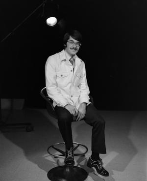 [Photograph of David Finfrock posing for a portrait in a chair]