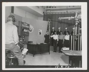 [Photograph of Navy soldiers on a WBAP-TV set]