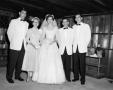 Photograph: [Bride with her parents and two groomsmen]