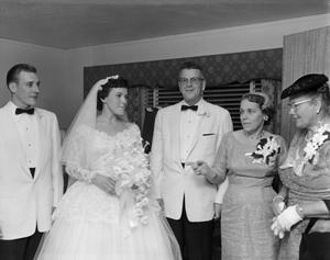 [Bride and groom with three wedding guests]