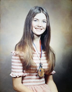 [Portrait of a girl wearing a medal]