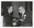 Primary view of [Paul Kruse accepting a certificate from University President C.C. "Jitter" Nolen]