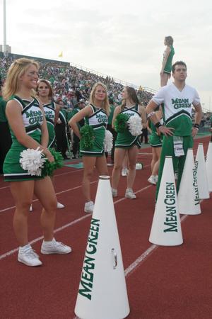 [NT Cheer team on a track at the UNT v Navy game]