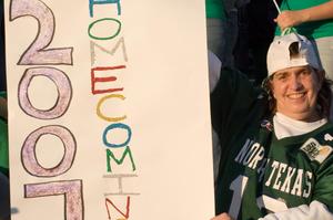 [Visitor with sign at Homecoming game, 2007]