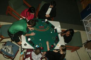 [Students around game table set-up for Casino Night]