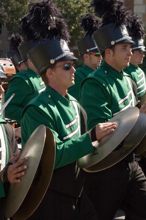 [Mean Green Brigade playing cymbals in UNT Homecoming Parade, 2007]