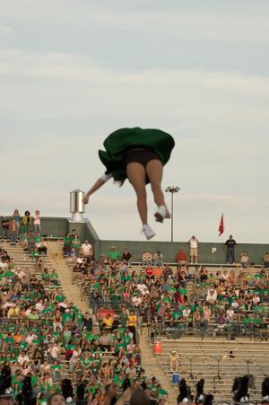 [Dancer spinning in air during UNT vs. Navy game, 2007]