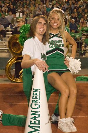[Cheer pair at rest during Homecoming game, 2007]