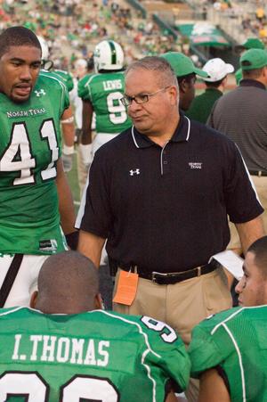 [Coach with players during UNT vs. Navy game, 2007]