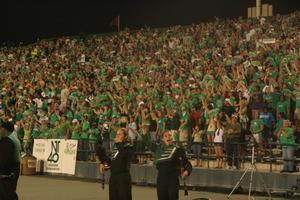[Band members and crowd at UNT v ULM game]