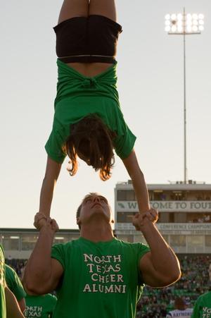 [NT Cheer alumni doing handstand at Homecoming game, 2007]