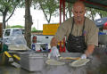 Photograph: [Man cooking quesadillas]
