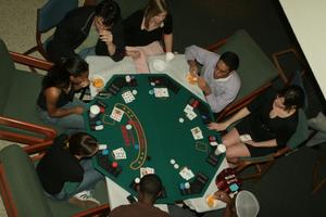 [Students around game table set-up at UNT Casino Night]