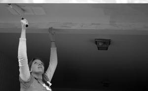 [Kimberly Terrell painting garage ceiling]