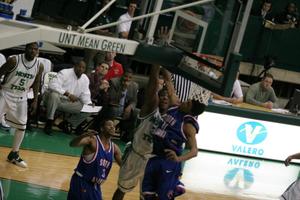 [Players jumping to the net in Men's Basketball game, January 31, 2008]