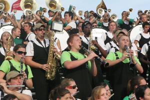 [Clarinet and saxophone players in stands at the UNT v Navy game]