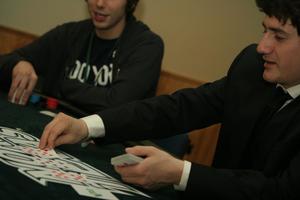 [Jonathan Gallegos laying out cards at a table at UNT's Casino Night]