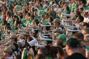 [Mean Green Brigade brass section performing]