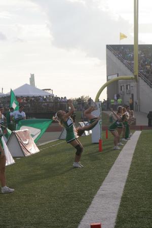 [NT Cheer performing flips at the UNT v Navy game]