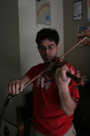 [Student practicing on violin]
