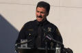 Photograph: [Chief Halstead at press conference podium]