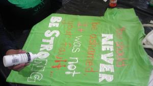 [Green shirt decorated for Clothesline Project]