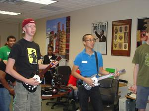 [Two students playing Guitar Hero during First Flight Week]