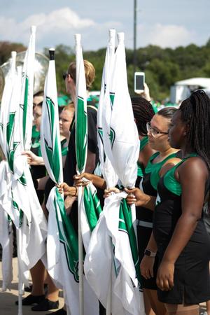 [North Texas Dance Team holding onto flags]