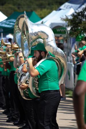 [Trombone player part of the Green Brigade, 3]