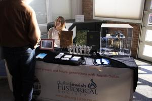 [Staff member seated at the Dallas Jewish Historical Society table]