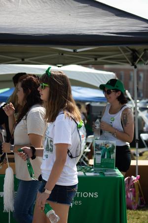 [Two tailgaters in UNT apparel]