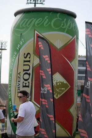 [Inflatable Dos Equis beer can]
