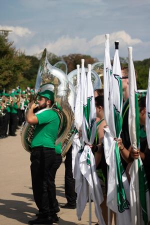 [Trombone player and the North Texas Dance Team]