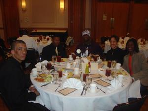 [People seated around table at 2005 Black History Month]