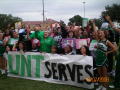 Photograph: [Gilda Garcia and students holding UNT SERVES banner 2]