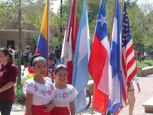 [Two girls beside flags at 2008 Carnaval]