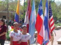 Photograph: [Two girls beside flags at 2008 Carnaval]