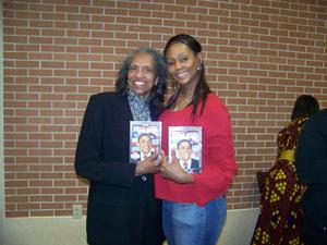 [Two women holding Barack Obama DVD]