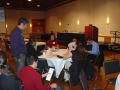 Photograph: [Students seated around table at Hispanic Heritage Month event]