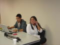 Photograph: [Elizabeth Nguyen at APAEC 2006 welcome table]