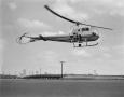 Photograph: [Bell Ranger helicopter in flight]