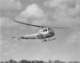 Photograph: [Bell Ranger helicopter in flight, 2]