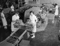 Primary view of [Lipton workers packaging tea boxes]