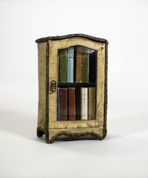 [Miniature cabinet filled with La Gracieuse books]