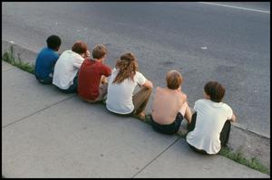 Primary view of object titled '[Teenagers Sitting on the Sidewalk]'.