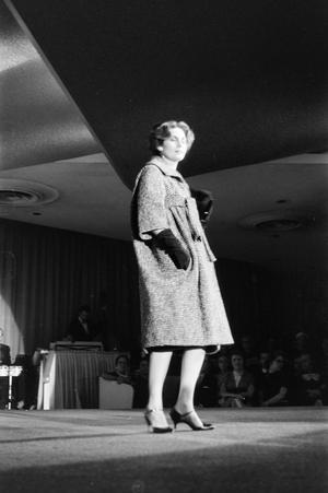 [Young woman modeling clothes on runway]