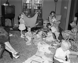 [Photograph of a group of children celebrating the Williams twins' birthday in a living room]