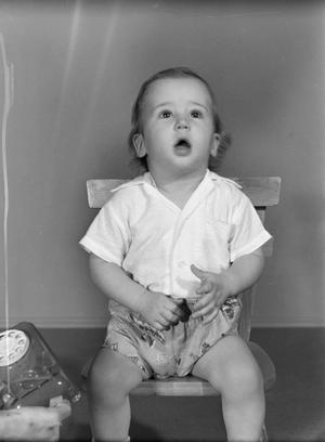 [Photograph of Byrd Williams IV sitting in a chair as a toddler]