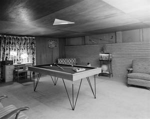 [Photograph of a billiard table in a room]