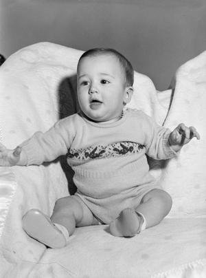 [Photograph of Byrd Williams IV posing on a couch as a baby]